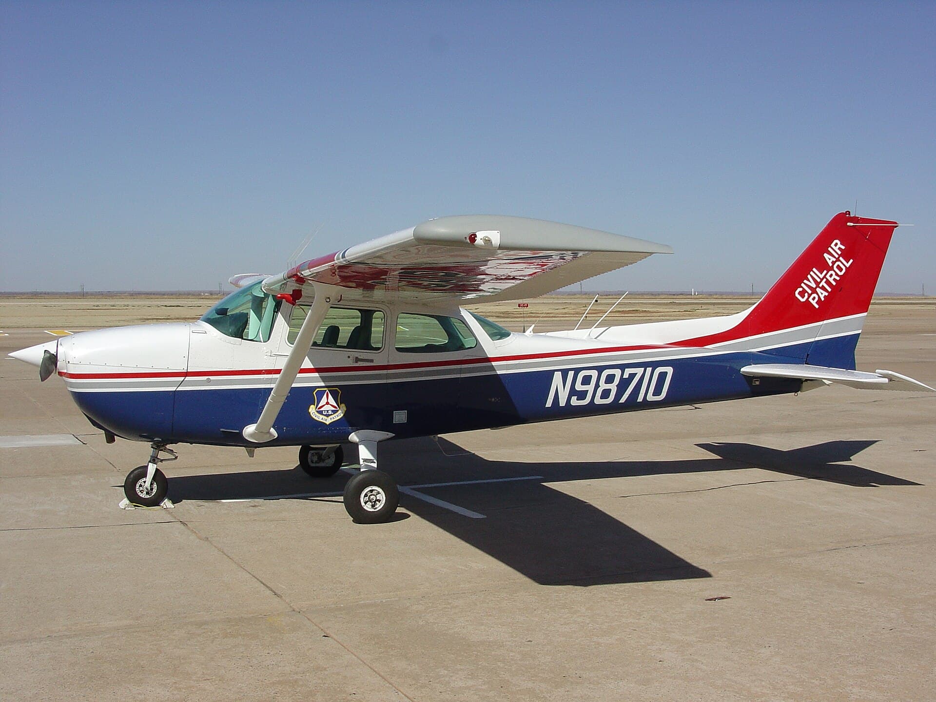 A Cessna 172 in United States Civil Air Patrol markings on the ramp, one of the utility roles the type still fills decades after delivery
