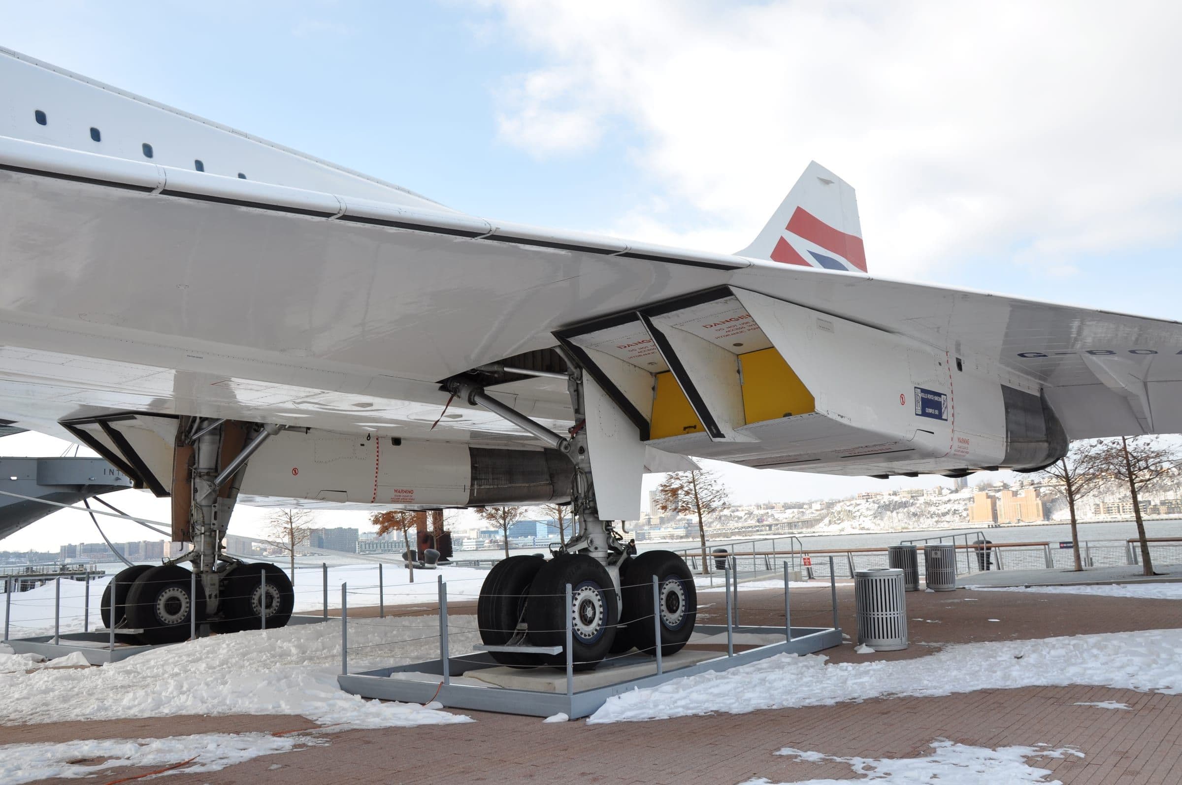 The underside of Concorde's ogival delta wing and main undercarriage, on the preserved British Airways aircraft G-BOAD at the Intrepid Museum, New York