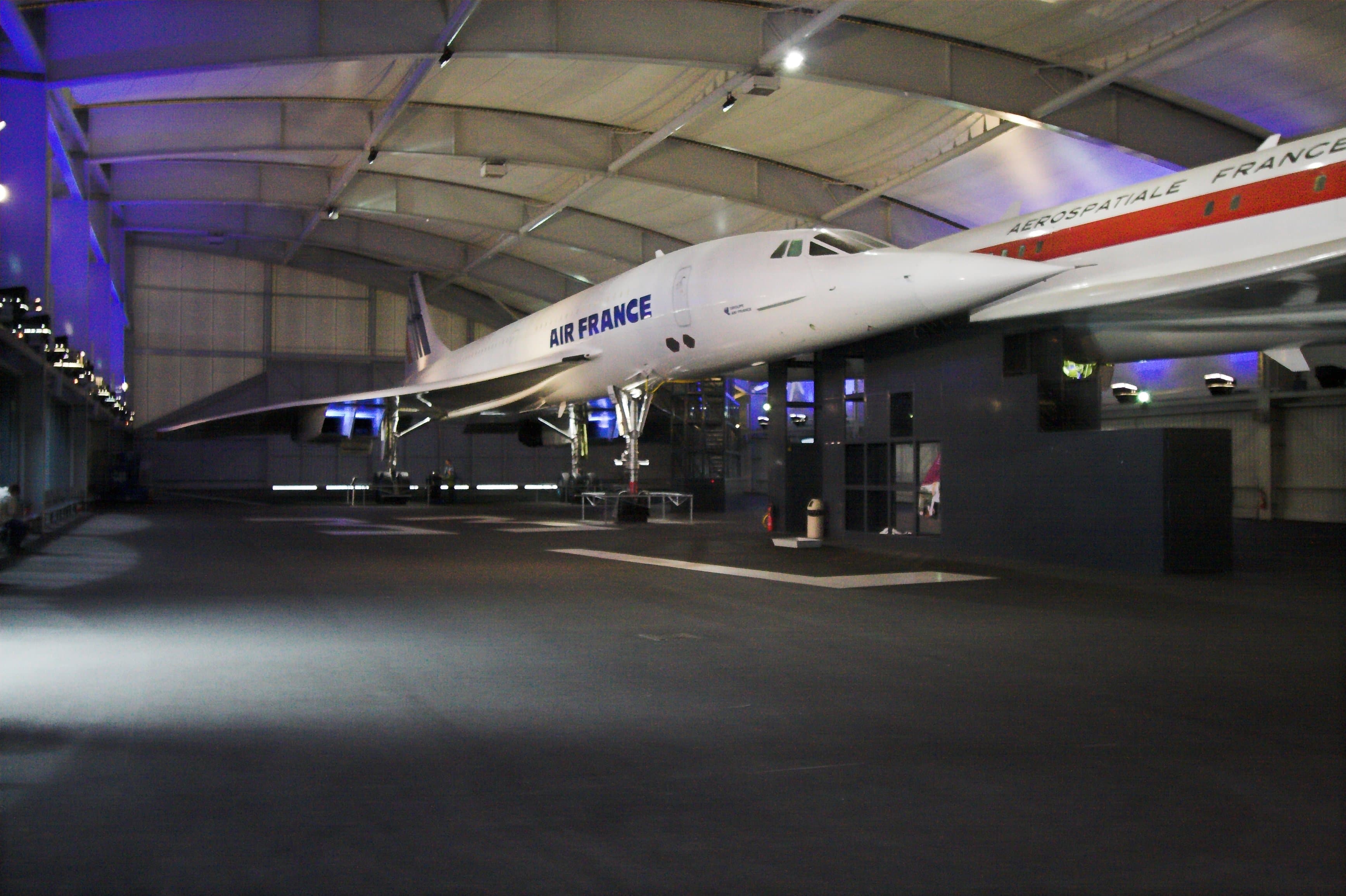 Two Concordes in the Concorde hall at the Musée de l'air et de l'espace, Le Bourget: the Air France production aircraft F-BTSD in front, an earlier prototype airframe in Aérospatiale house colours behind