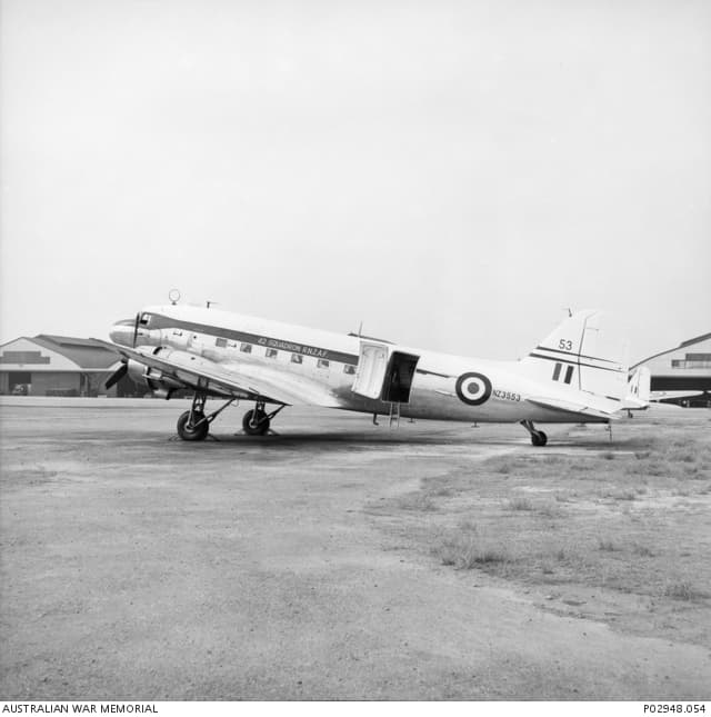 A No. 42 Squadron RNZAF Douglas C-47 Dakota, NZ3553, parked on an airstrip in occupied Japan, around 1954