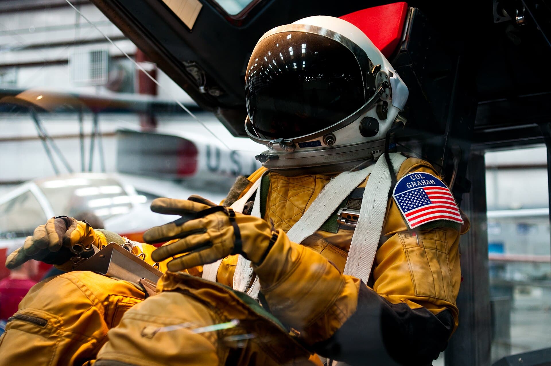 Close view of a David Clark S1030 full pressure suit worn by SR-71 crews, glove and helmet visible in a museum display