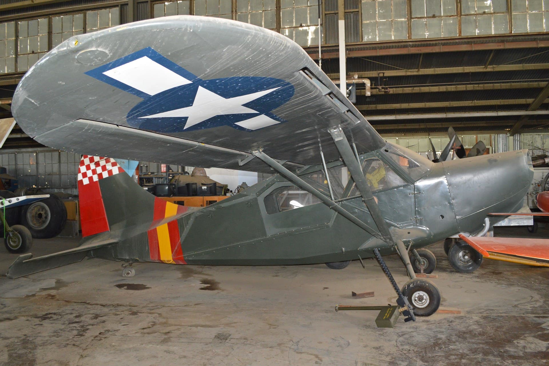 A restored Stinson L-5E Sentinel in olive drab, registration N62091