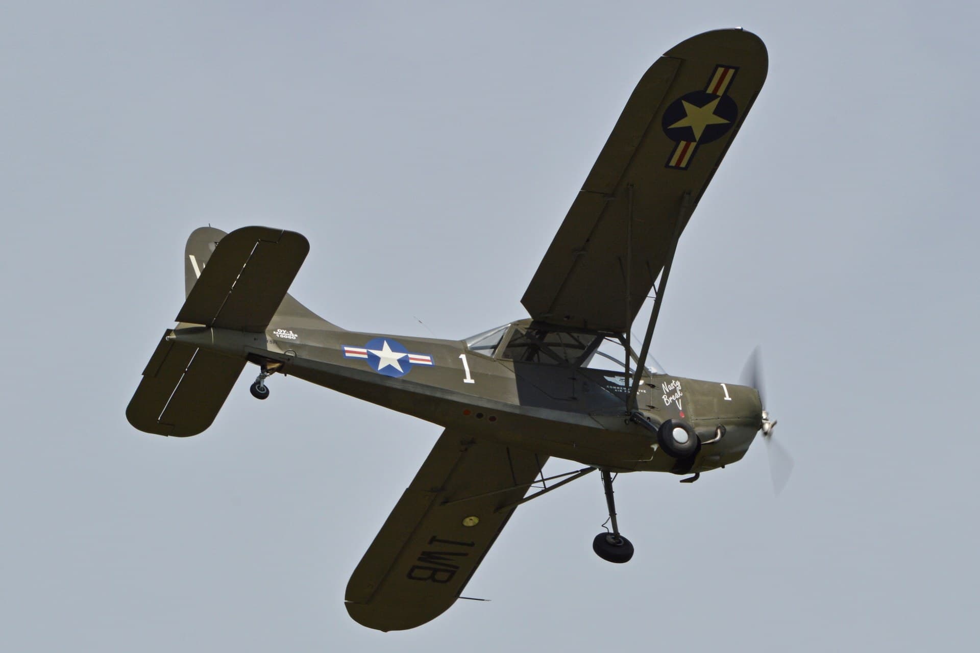 A restored Stinson L-5 Sentinel, registration N9315H, wearing wartime invasion markings