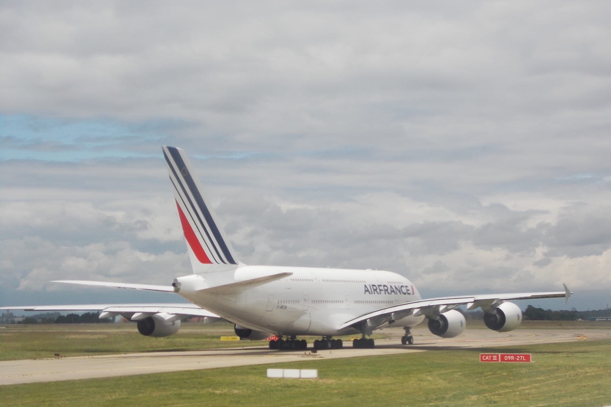 An Air France Airbus A380 lined up on runway 09R/27L at Paris-Charles de Gaulle.