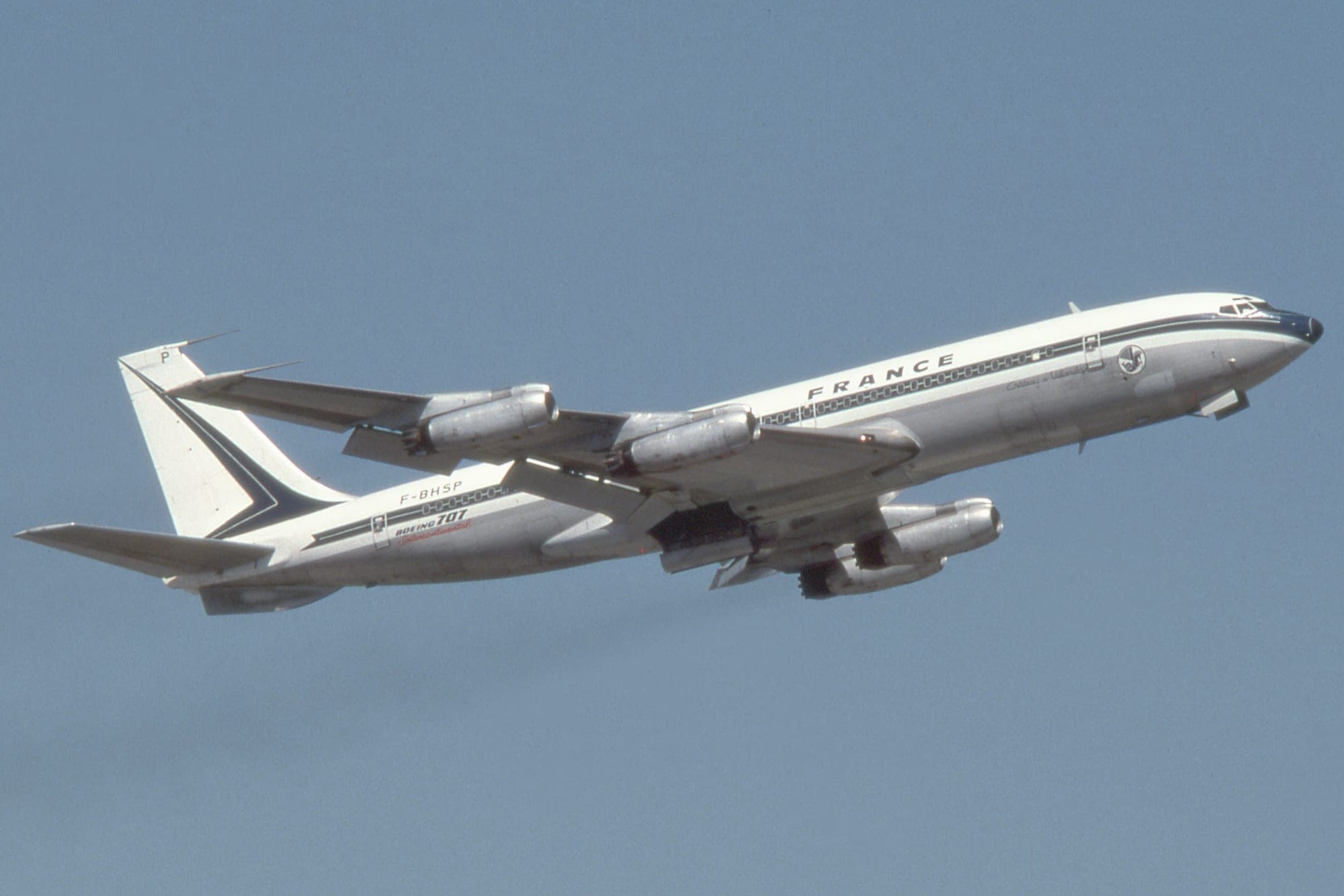 An Air France Boeing 707-328 Intercontinental climbing out of London Heathrow in the blue cheatline livery.