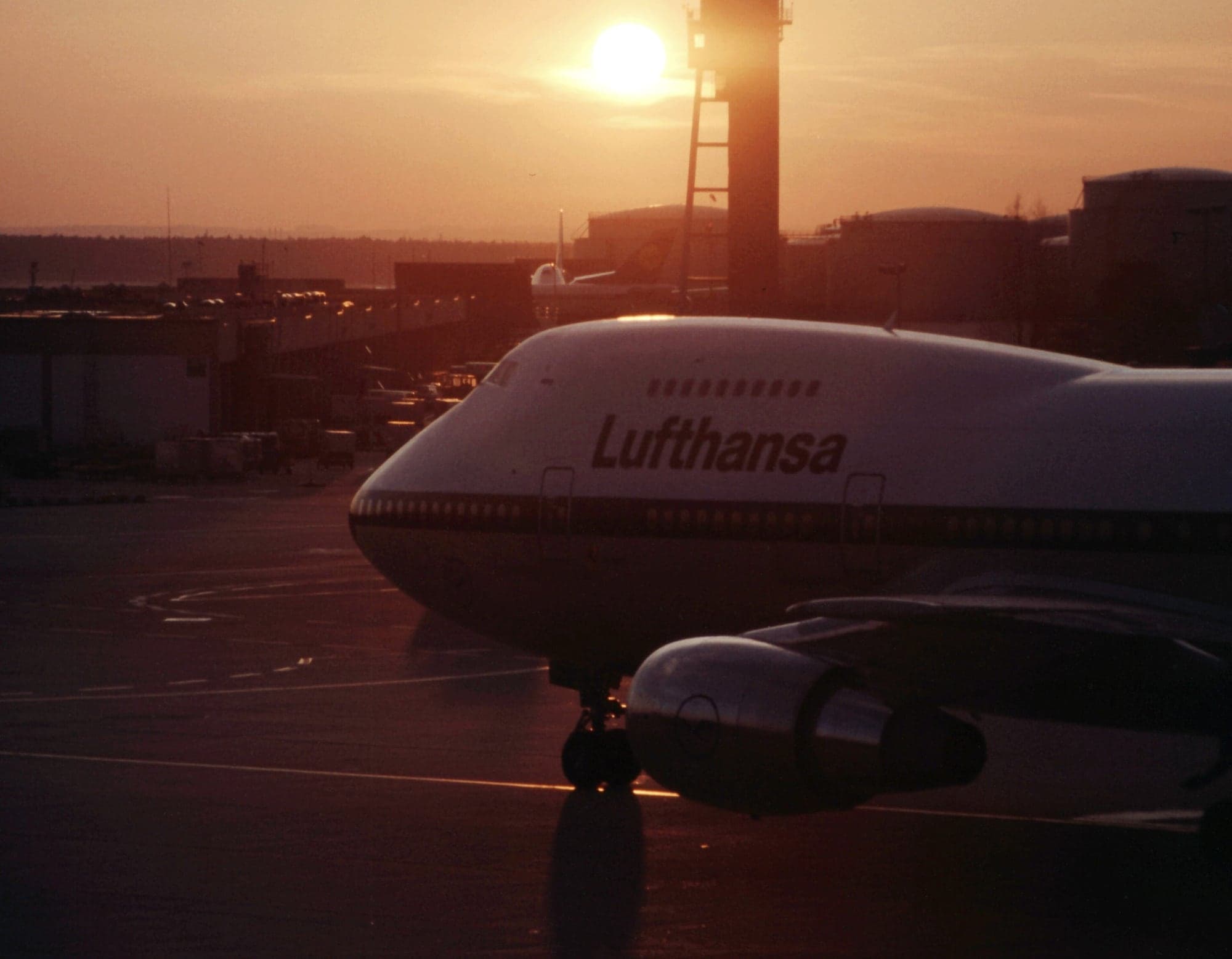 Lufthansa Boeing 747-230 D-ABZE at Frankfurt at sunset in the 1980s, the control tower behind.