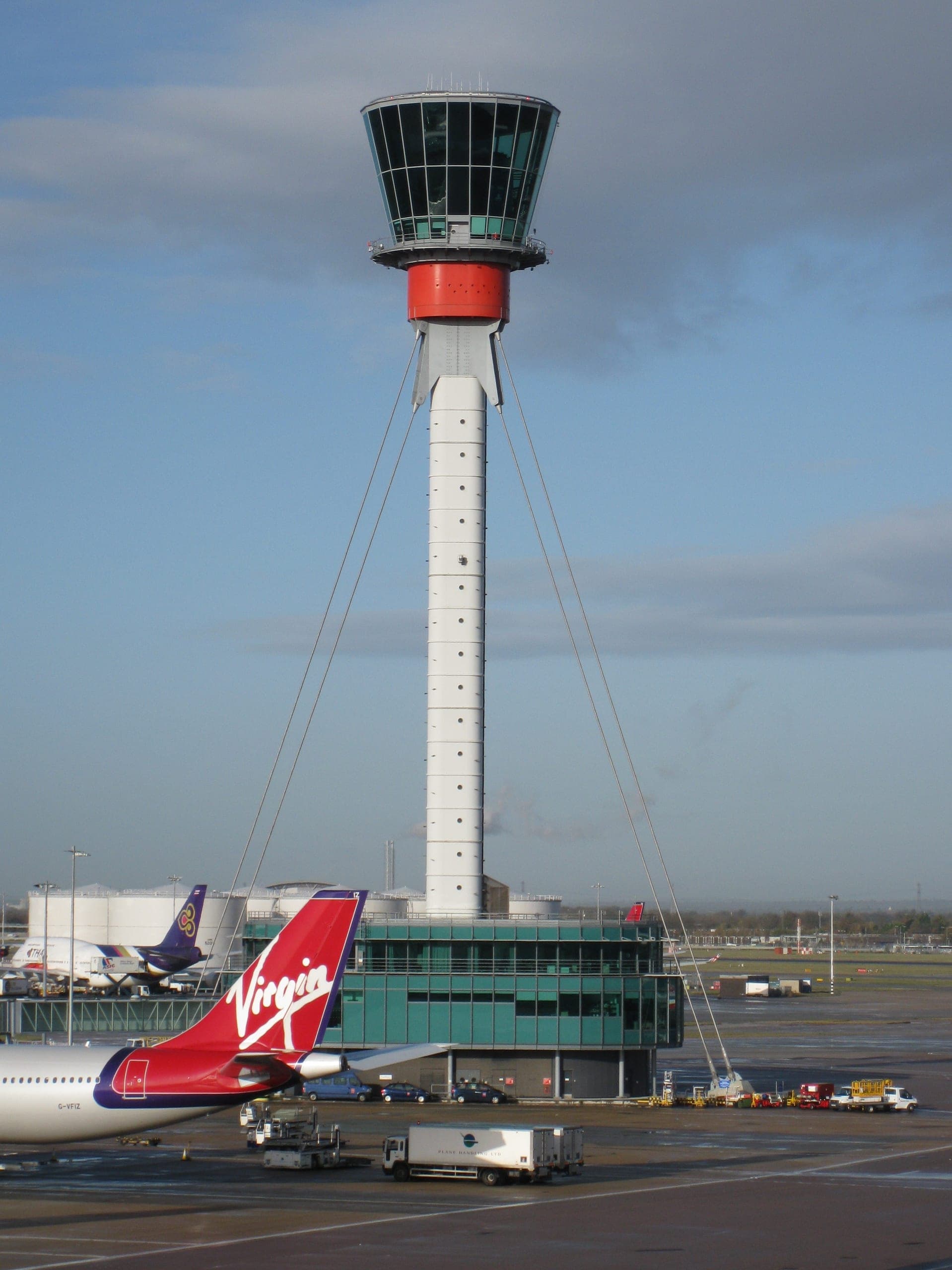 The 87-metre Heathrow control tower, designed by Richard Rogers Partnership, rising above the Terminal 3 apron
