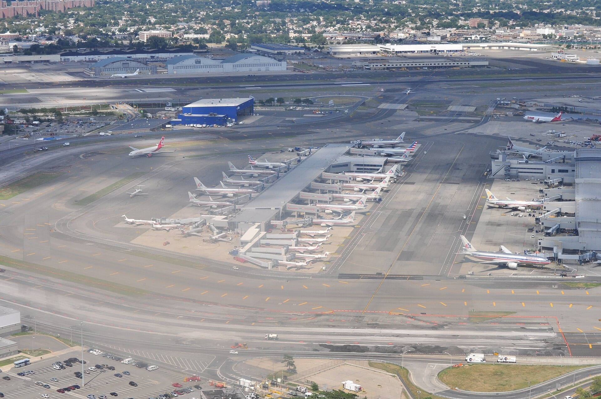 Terminal 8 from the south-west in 2013, American Airlines aircraft at its concourses with Queens stretching beyond