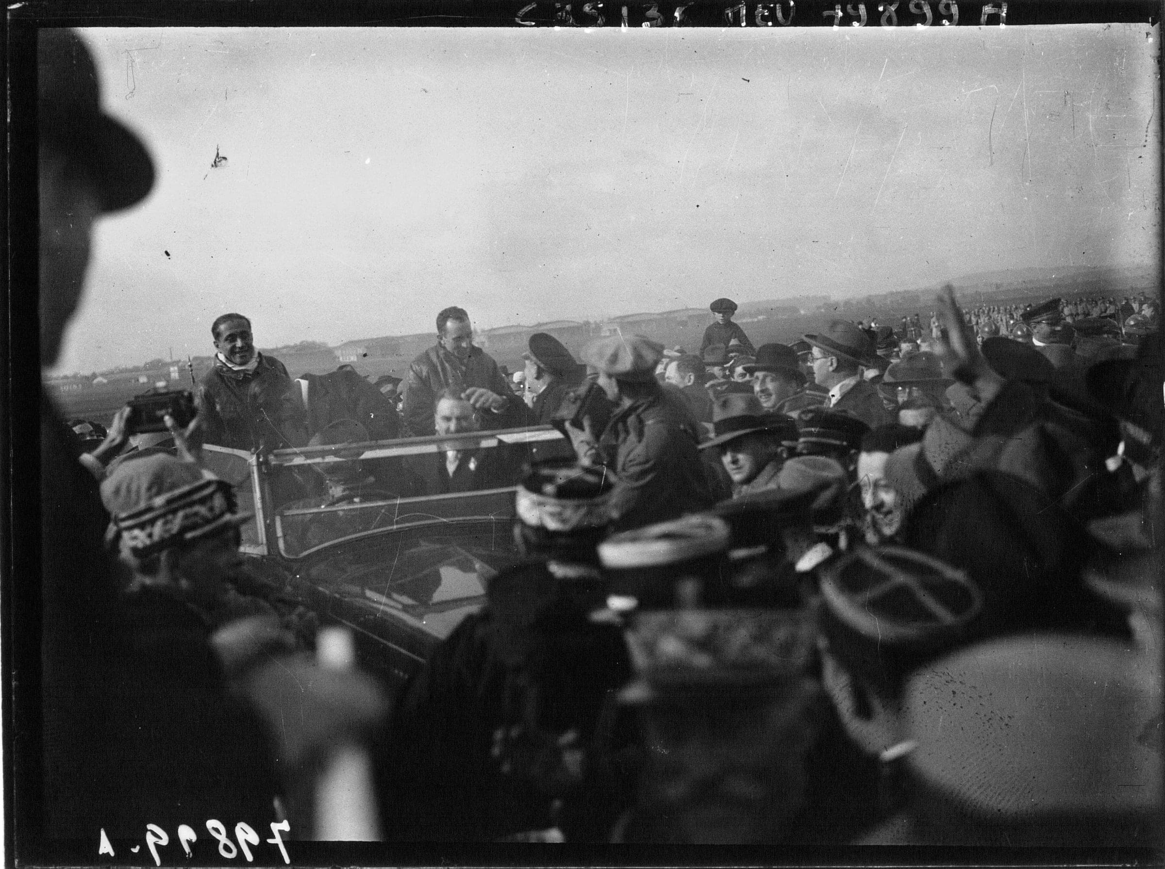 A dense crowd of officials and spectators at Le Bourget welcoming Dieudonné Costes and Maurice Bellonte in October 1930
