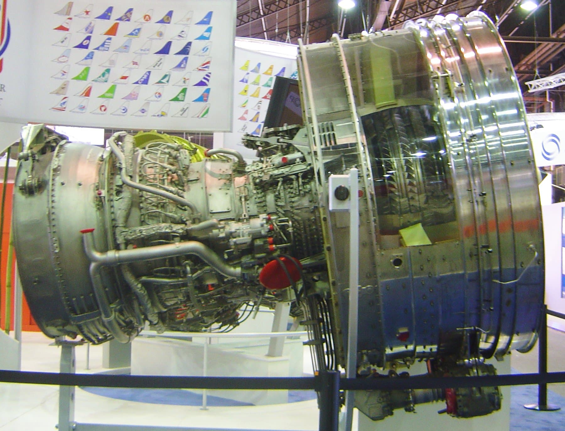 A CFM56 displayed without its nacelle, showing the fan case, the external pipework and the accessory gearbox