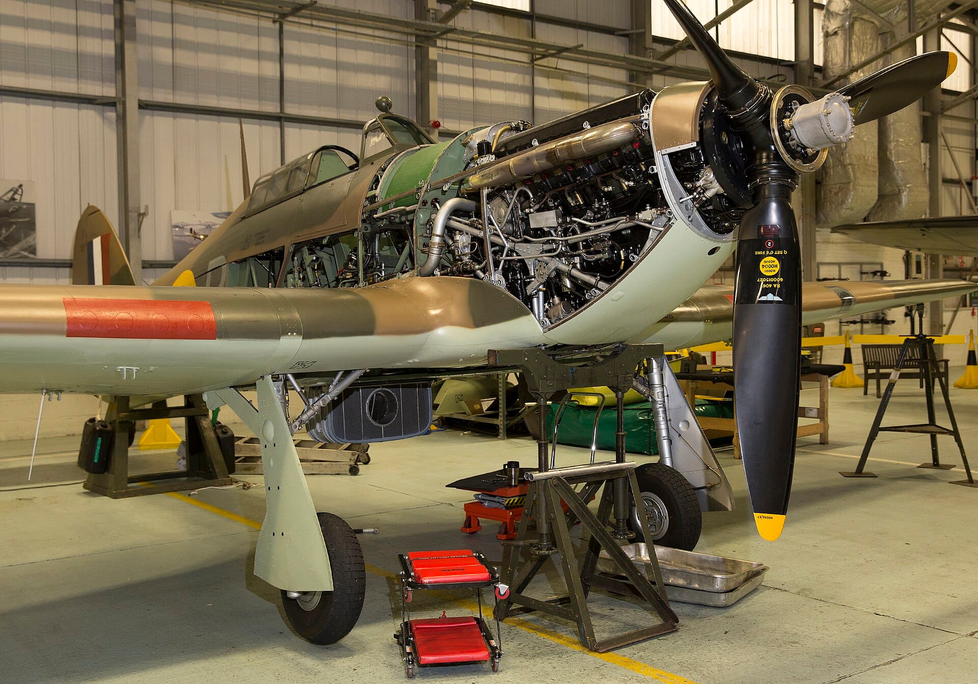 Hawker Hurricane LF363 of the Battle of Britain Memorial Flight under maintenance with its cowling panels removed, the installed Merlin exposed on its bearer frame