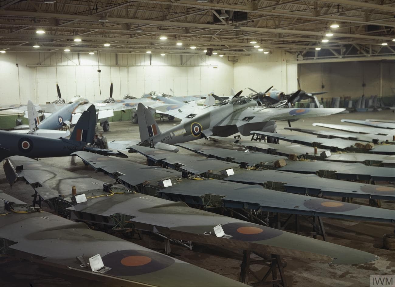Wooden Mosquito fuselages and airframes at various stages of assembly on the factory floor at Hatfield in 1943
