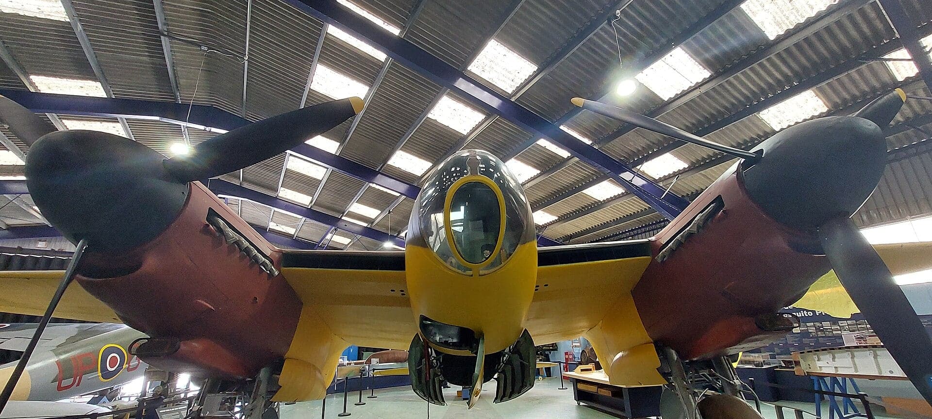 The yellow Mosquito prototype W4050 in the main hangar of the de Havilland Aircraft Museum