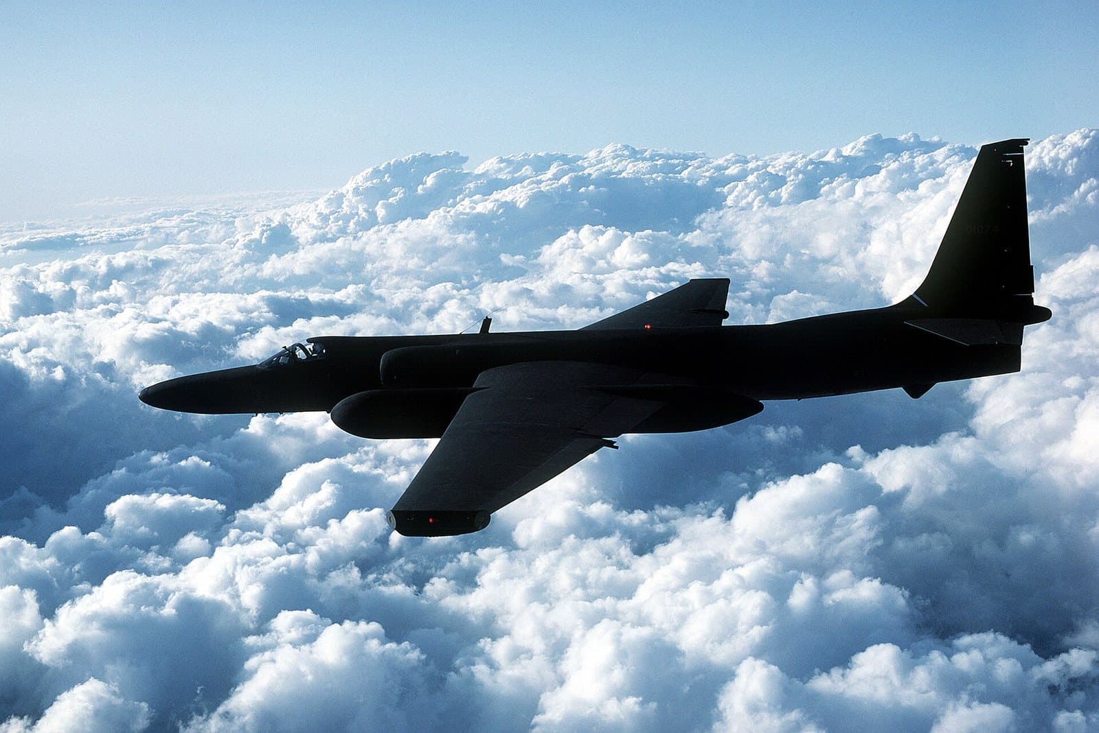 A black Lockheed TR-1, a U-2 variant, in flight with its very long glider-like wings