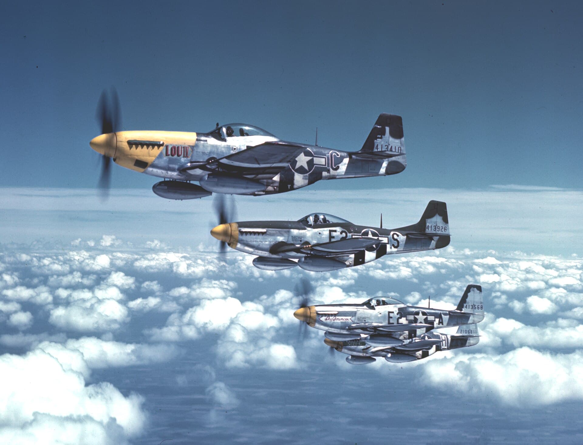 The "Bottisham Four", four P-51D Mustangs of the 361st Fighter Group photographed in close formation from a B-17, 1944