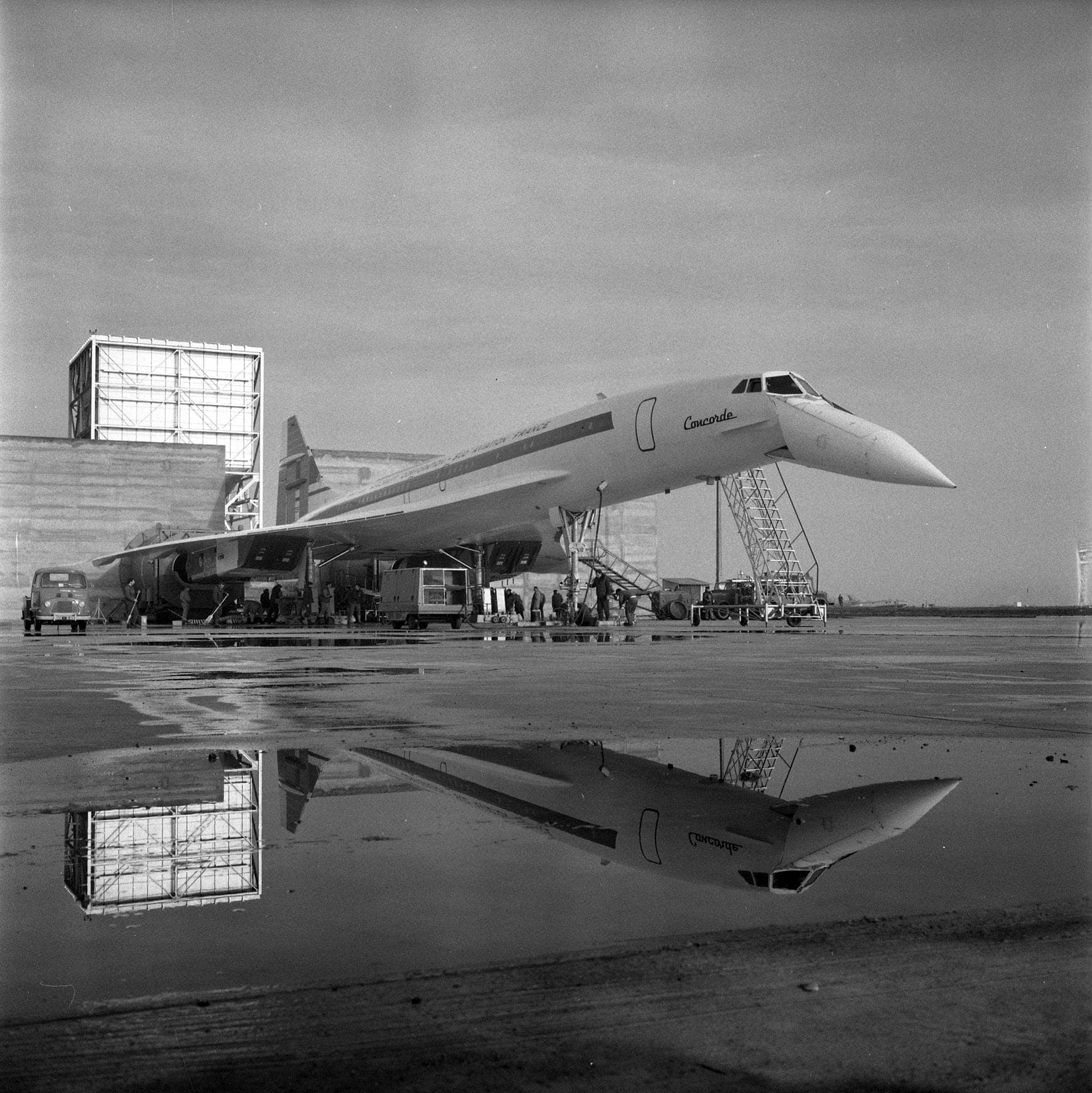Blagnac, 23 February 1968: a Concorde parked in the noise-suppression enclosure for ground sound tests, mechanics at work around it