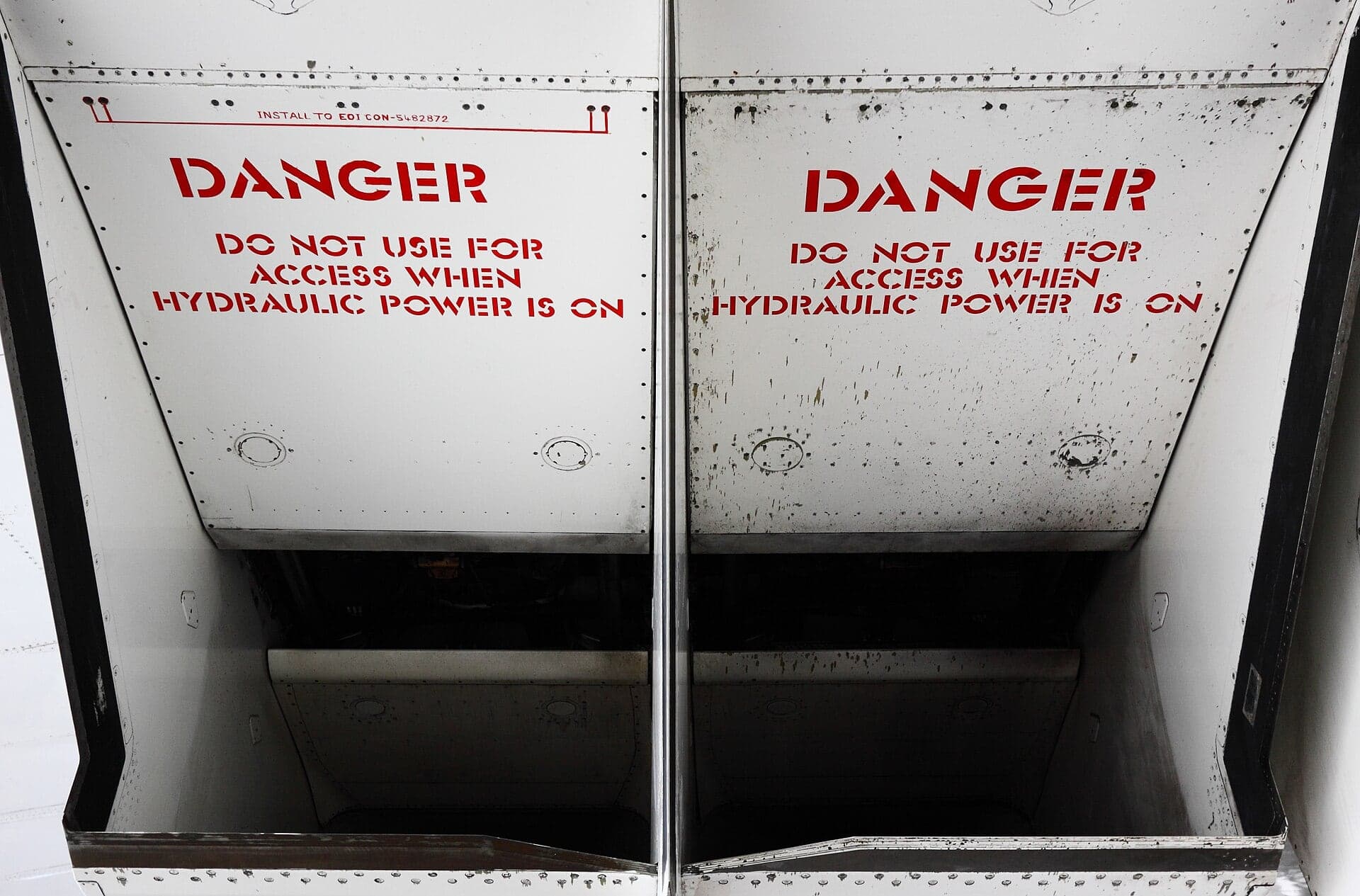 Looking up into the intakes of Concorde G-BOAG at the Museum of Flight in Seattle, with the variable ramps and hydraulic warning notices visible